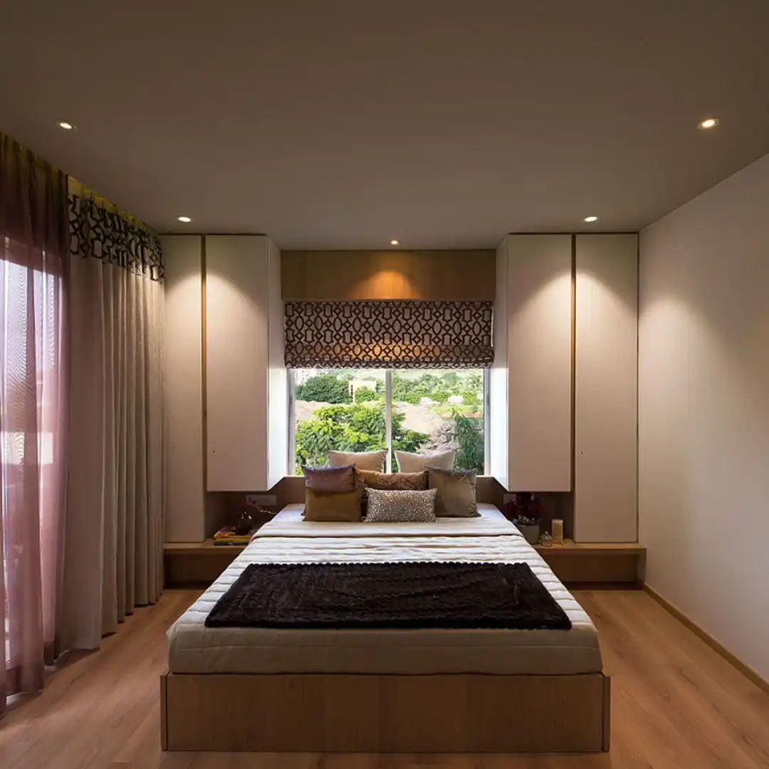 Living room with orange sofa and wooden partition